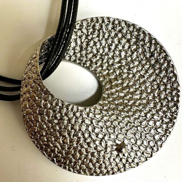 Round silver tone pendant necklace on long black cord - Picture 9 of 10